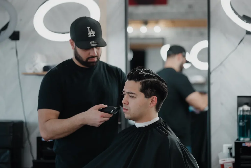Professional barber providing a men's haircut in Richmond Hill