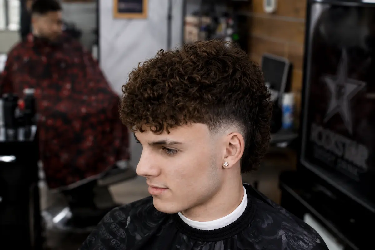 Curly fade haircut completed by a barber in Richmond Hill
