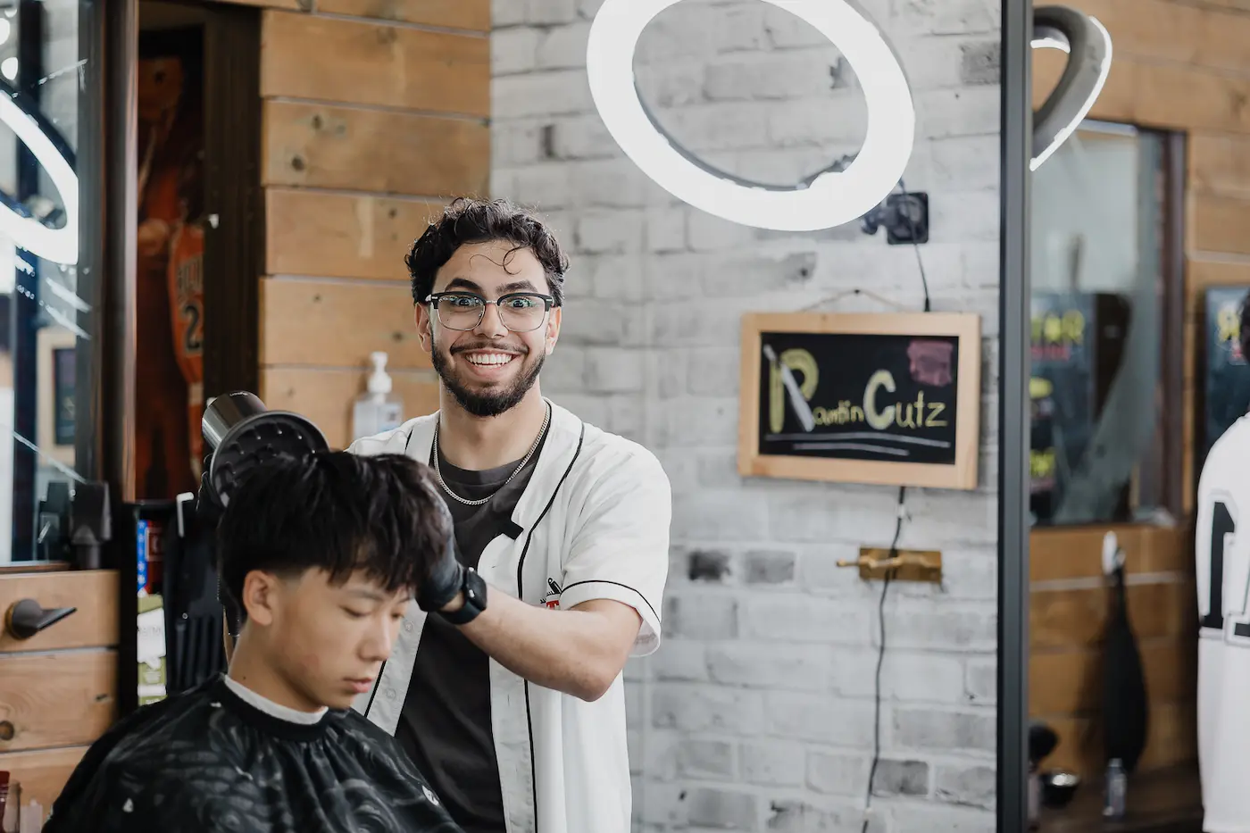 Experienced Richmond Hill barber helping a client choose the right haircut