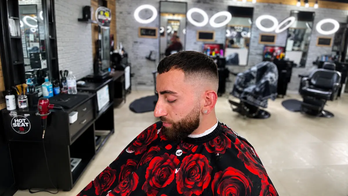 Low fade summer haircut with beard blend at a Richmond Hill barbershop
