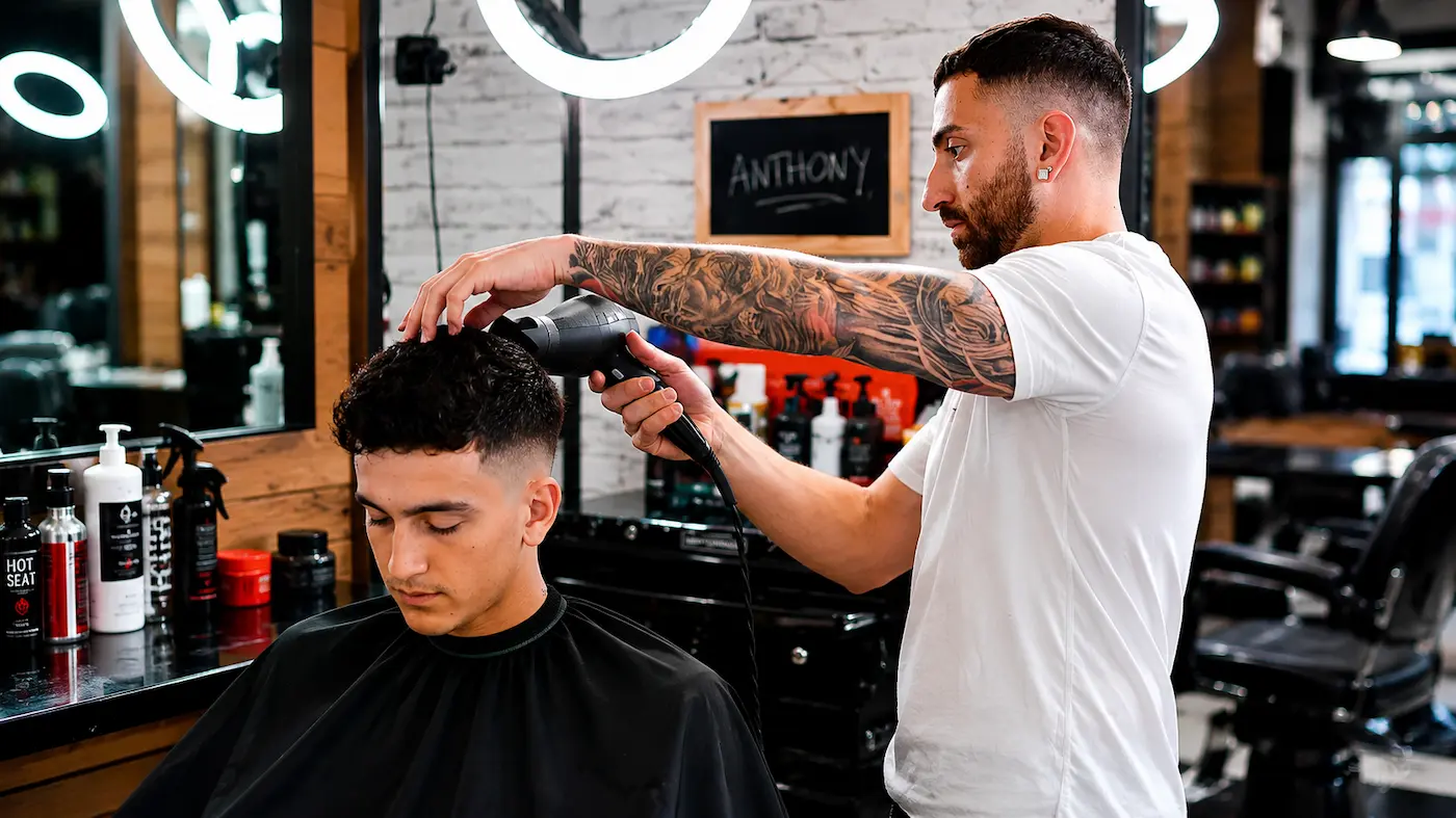 Barber trimming a client's hair during a summer haircut appointment in Richmond Hill