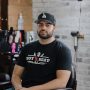 Brandon J, senior barber at Hot Seat Barbershop